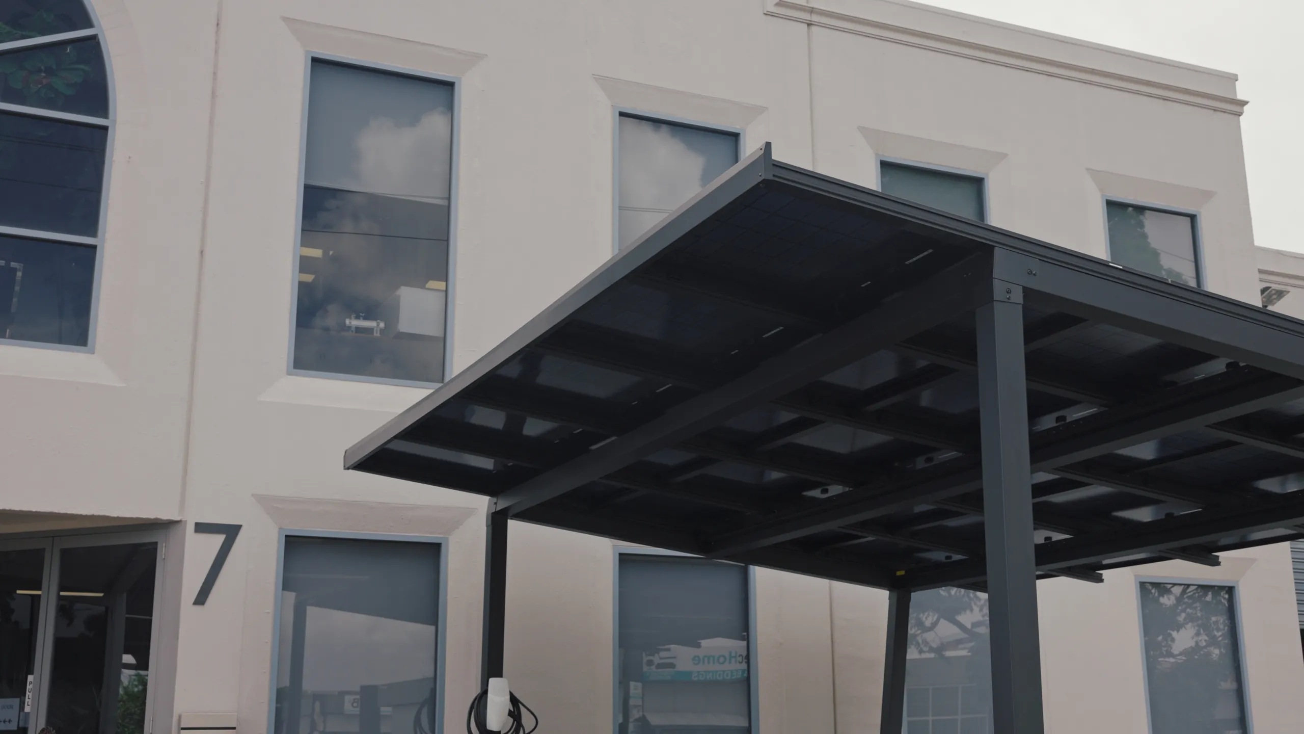 Solar carport canopy with integrated panels, close up
